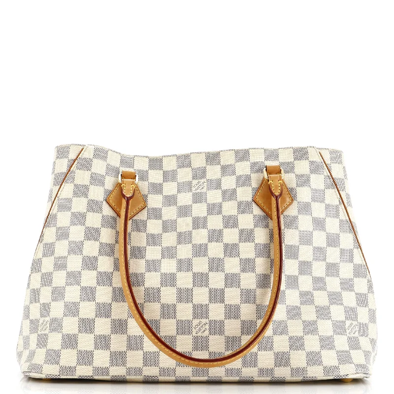 Ladies Louis Vuitton Petite Malle bags in a pastel color for a soft lookCalvi Handbag Damier