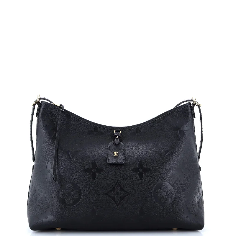 Louis Vuitton Twist bags with a crystal - embellished LV - turnlockCarryAll Hobo Monogram Empreinte Giant MM