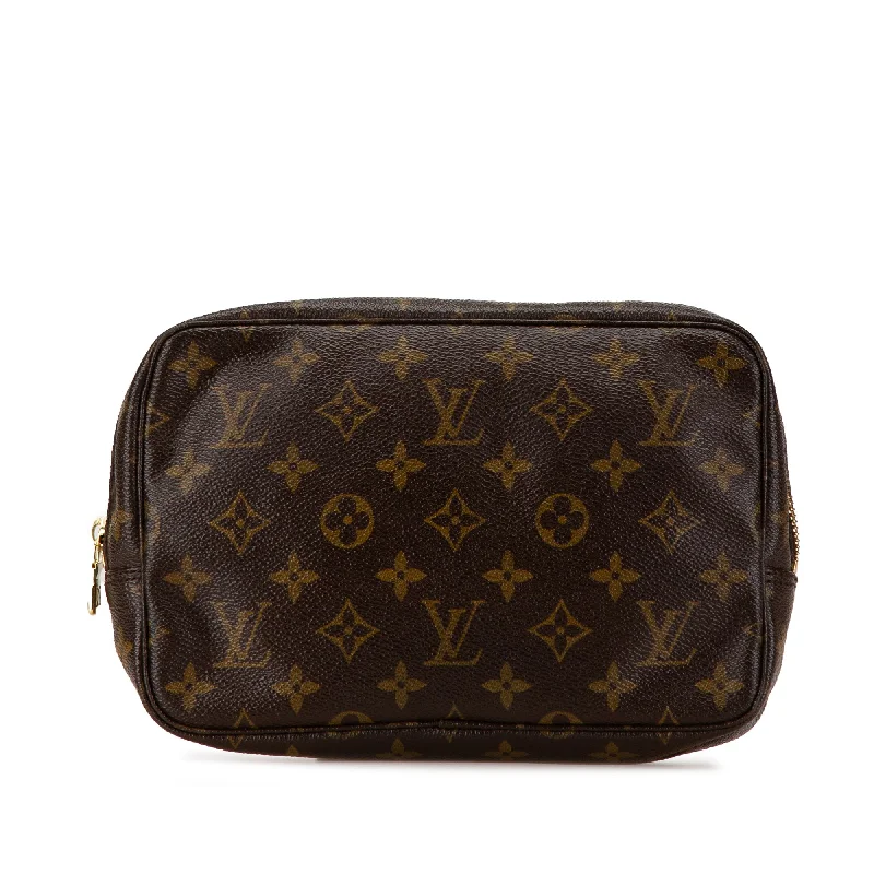 Louis Vuitton Twist bags with the iconic LV - turnlock closureBrown Louis Vuitton Monogram Trousse Toilette 23 Clutch Bag