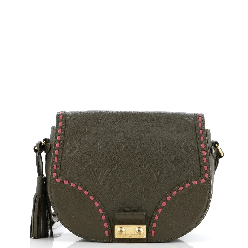 Louis Vuitton Twist bags with a contrast - colored interior for visual interestJunot Handbag Monogram Empreinte Leather