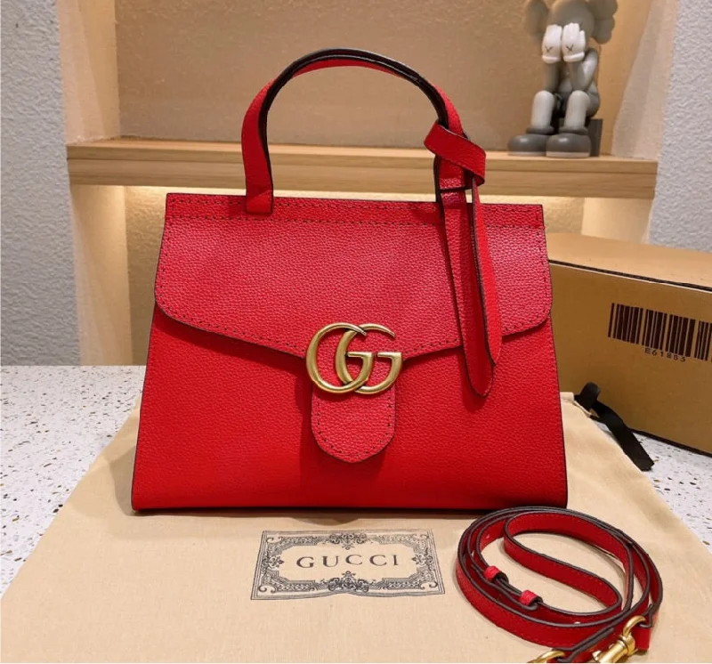 Women Gucci bags with a snap - button closure and a decorative charmGucci woman leather shoulder handbag