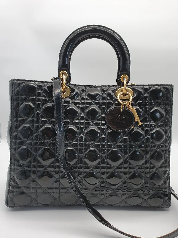 Christian Dior handbags with a snap - button closure and a decorative buckleDIOR